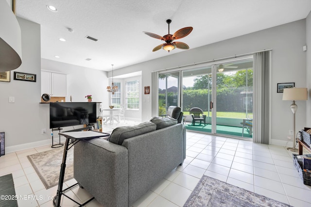 6542 Burnham Cir, Ponte Vedra Beach, FL 32082 - living room featuring ceiling fan, a chandelier, light tile patterned floors, recessed lighting, and baseboards