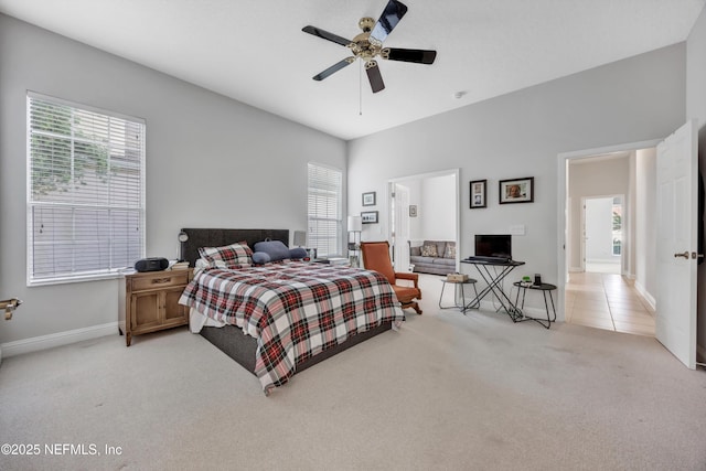 6542 Burnham Cir, Ponte Vedra Beach, FL 32082 - bedroom featuring light colored carpet, multiple windows, baseboards, and a ceiling fan