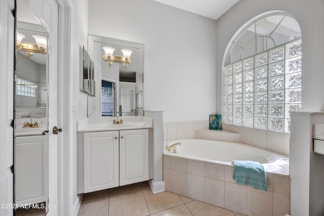 6542 Burnham Cir, Ponte Vedra Beach, FL 32082 - bathroom with vanity, a garden tub, and tile patterned flooring