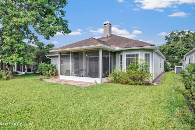 6542 Burnham Cir, Ponte Vedra Beach, FL 32082 - back of house featuring a sunroom, a yard, a chimney, cooling unit, and a shingled roof