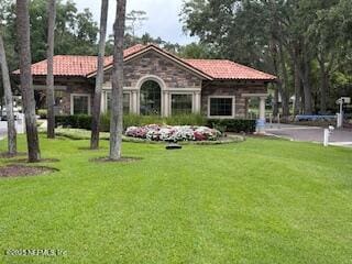 6542 Burnham Cir, Ponte Vedra Beach, FL 32082 - rear view of property with a lawn and stone siding