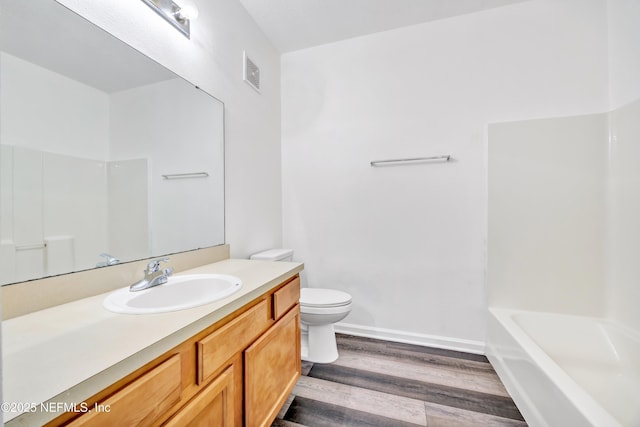 3641 Kirkpatrick Cir Unit 14-2, Jacksonville, FL 32210 - full bathroom with wood finished floors, vanity, toilet, and shower / bath combination