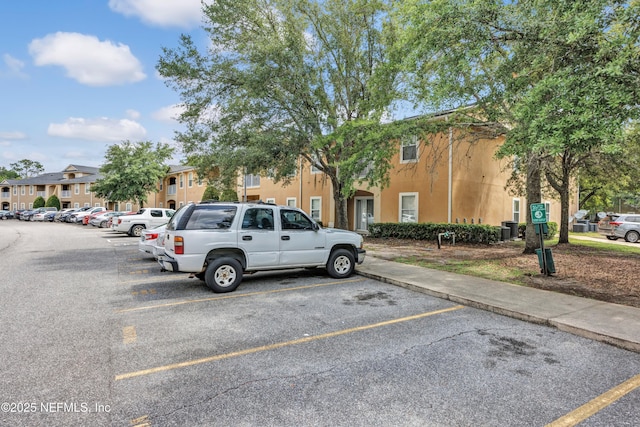 3641 Kirkpatrick Cir Unit 14-2, Jacksonville, FL 32210 - uncovered parking lot featuring a residential view