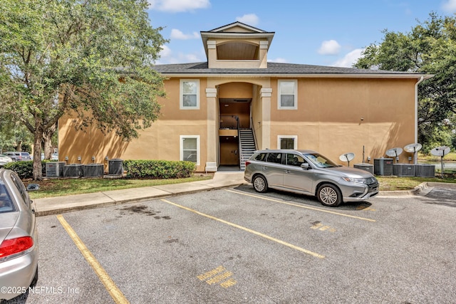 3641 Kirkpatrick Cir Unit 14-2, Jacksonville, FL 32210 - view of property with uncovered parking and cooling unit