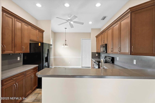 1327 Castle Pines Cir, Saint Augustine, FL 32092 - kitchen featuring black appliances, a ceiling fan, a peninsula, recessed lighting, and hanging light fixtures