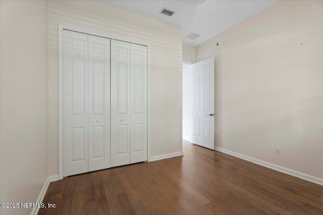 1327 Castle Pines Cir, Saint Augustine, FL 32092 - unfurnished bedroom with wood finished floors and a closet