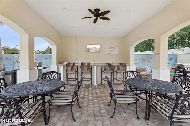 1327 Castle Pines Cir, Saint Augustine, FL 32092 - view of patio with outdoor dining space, ceiling fan, a bar, and area for grilling