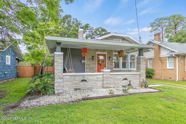 1032 Ingleside Ave, Jacksonville, FL 32205 - view of front of home featuring a chimney, covered porch, and stone siding