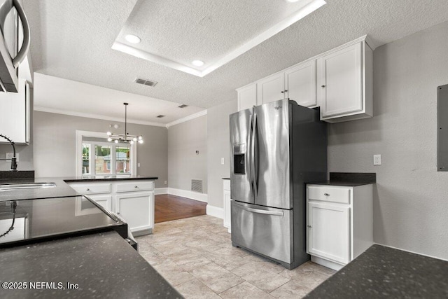 1032 Ingleside Ave, Jacksonville, FL 32205 - kitchen featuring stainless steel fridge with ice dispenser, ornamental molding, a textured ceiling, white cabinets, and a chandelier
