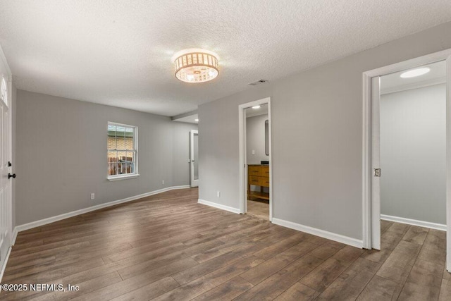 1032 Ingleside Ave, Jacksonville, FL 32205 - unfurnished bedroom with wood finished floors, a textured ceiling, and ensuite bathroom