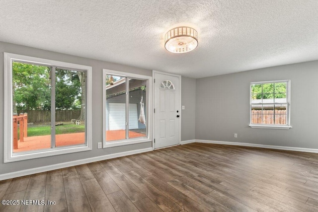 1032 Ingleside Ave, Jacksonville, FL 32205 - empty room featuring wood finished floors, a textured ceiling, and plenty of natural light