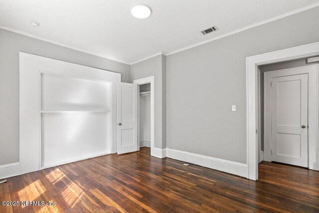 1032 Ingleside Ave, Jacksonville, FL 32205 - unfurnished bedroom with ornamental molding, wood finished floors, a closet, and a textured ceiling