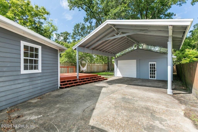 1032 Ingleside Ave, Jacksonville, FL 32205 - view of parking / parking lot featuring a fenced backyard and a detached garage