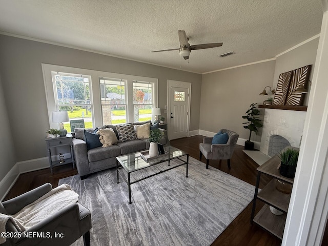 1032 Ingleside Ave, Jacksonville, FL 32205 - living room with wood finished floors, a ceiling fan, a textured ceiling, and ornamental molding