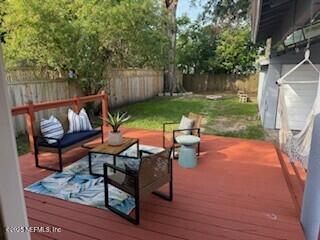 1032 Ingleside Ave, Jacksonville, FL 32205 - wooden terrace featuring a fenced backyard and an outdoor living space