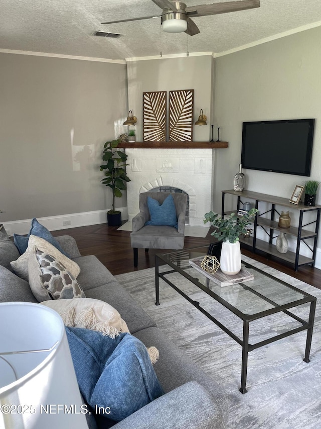 1032 Ingleside Ave, Jacksonville, FL 32205 - living area with a textured ceiling, wood finished floors, ornamental molding, and a ceiling fan