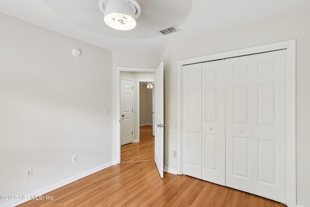 2002 Knottingham Trace Ln, Jacksonville, FL 32246 - unfurnished bedroom featuring light wood-type flooring and a closet