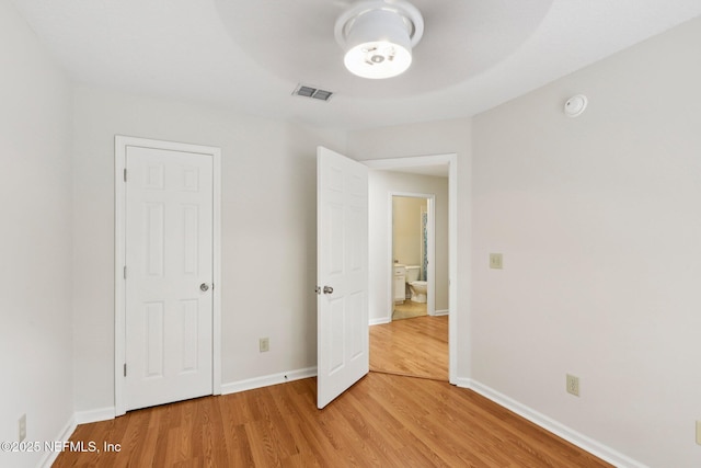 2002 Knottingham Trace Ln, Jacksonville, FL 32246 - unfurnished bedroom featuring light wood-style flooring and baseboards
