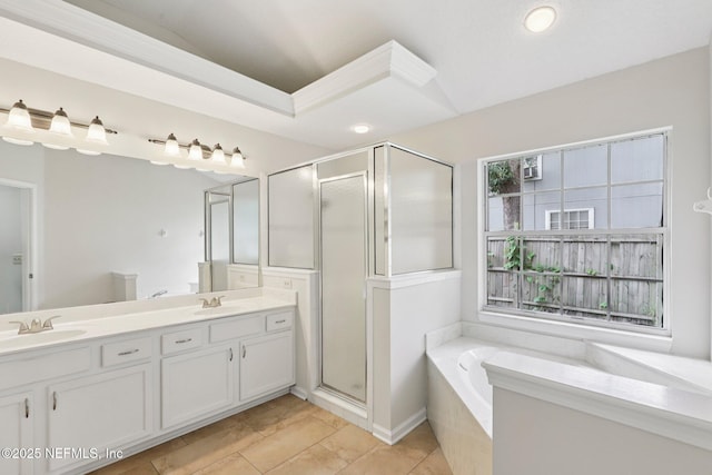 2002 Knottingham Trace Ln, Jacksonville, FL 32246 - bathroom with double vanity, a stall shower, a bath, tile patterned flooring, and recessed lighting