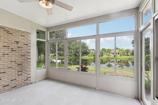 2002 Knottingham Trace Ln, Jacksonville, FL 32246 - unfurnished sunroom with a water view, a ceiling fan, and brick wall