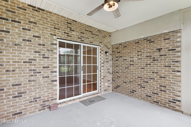 2002 Knottingham Trace Ln, Jacksonville, FL 32246 - doorway to property featuring a ceiling fan, brick siding, and a patio area