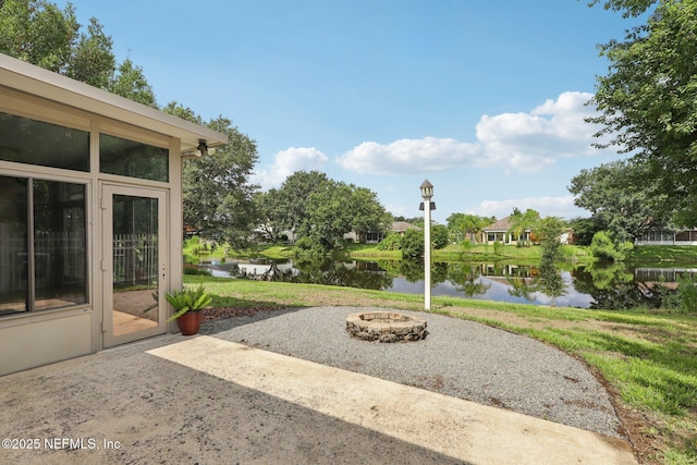 2002 Knottingham Trace Ln, Jacksonville, FL 32246 - view of patio / terrace featuring an outdoor fire pit and a water view
