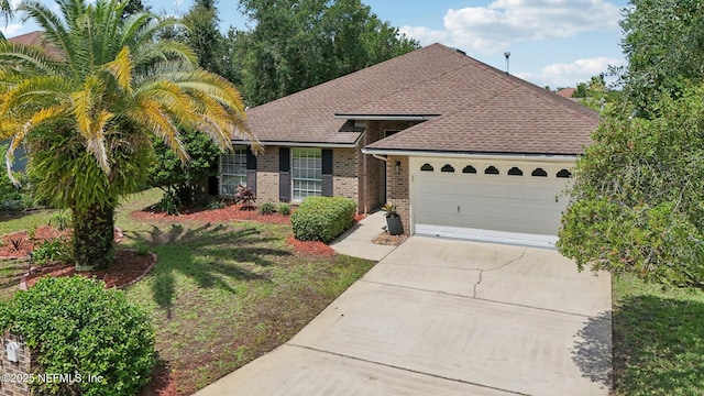 2002 Knottingham Trace Ln, Jacksonville, FL 32246 - view of front of property with brick siding, concrete driveway, an attached garage, a shingled roof, and a front lawn