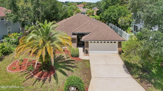2002 Knottingham Trace Ln, Jacksonville, FL 32246 - view of front facade with brick siding, a garage, concrete driveway, and roof with shingles