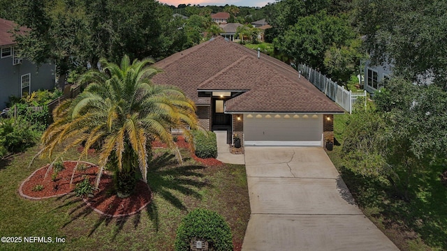2002 Knottingham Trace Ln, Jacksonville, FL 32246 - view of front of house featuring brick siding, concrete driveway, and an attached garage