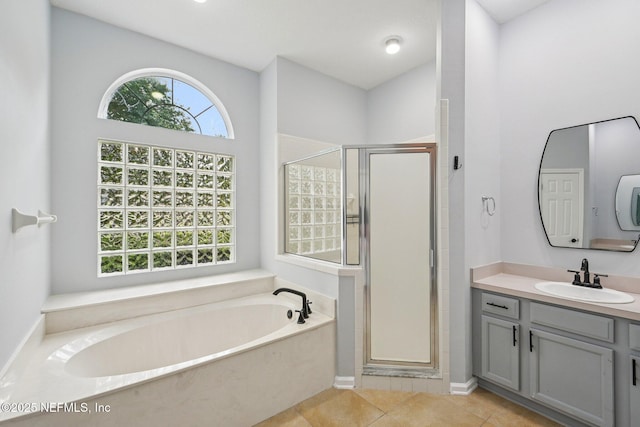 1867 Willesdon Dr E, Jacksonville, FL 32246 - full bath with a bath, a stall shower, vanity, and tile patterned flooring
