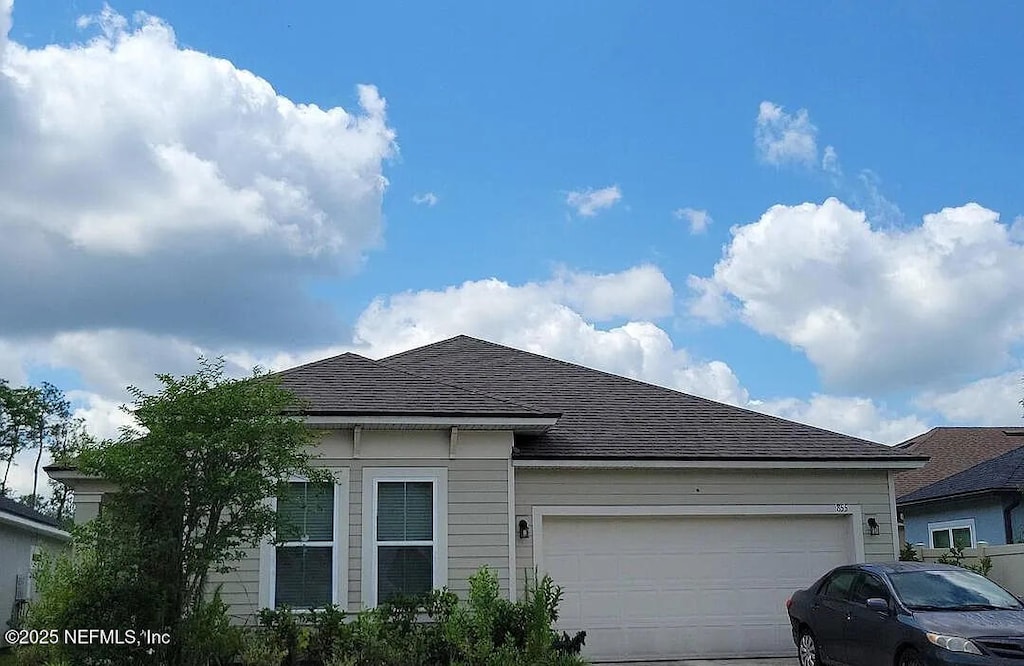 855 Sycamore Way, Orange Park, FL 32073 - view of front of home featuring a garage, driveway, and a shingled roof