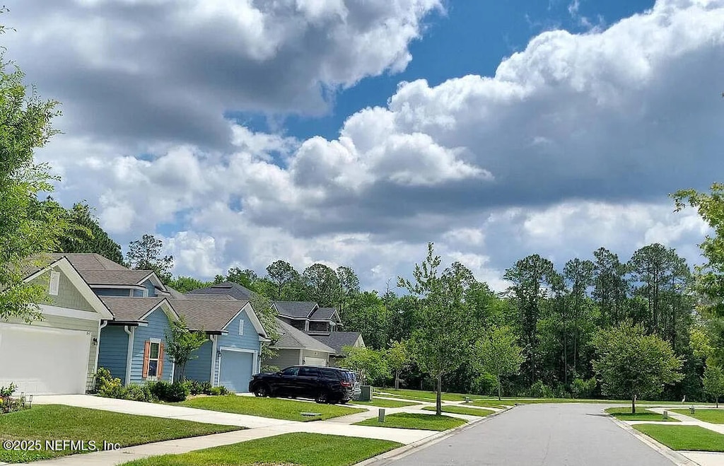 855 Sycamore Way, Orange Park, FL 32073 - view of asphalt street featuring sidewalks, curbs, and a residential view