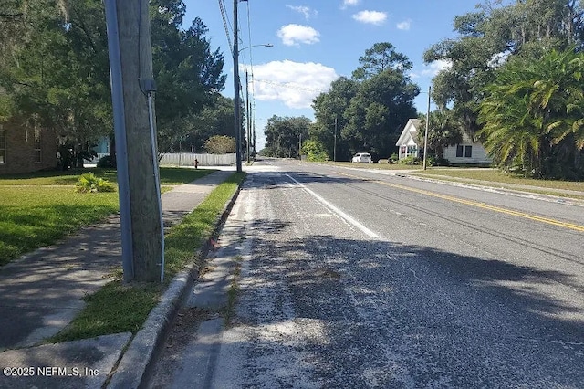 21813 SE 69th Ave, Hawthorne, FL 32640 - view of asphalt street with sidewalks, curbs, and street lights