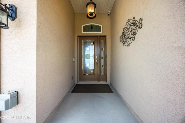 2144 S Sorrento Hills Rd, Saint Augustine, FL 32092 - doorway to property featuring stucco siding