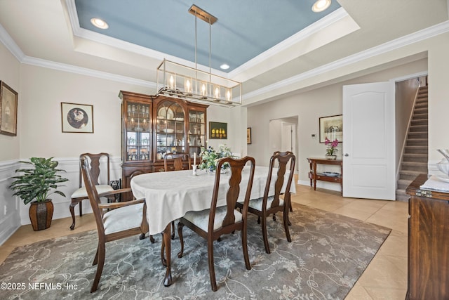 2144 S Sorrento Hills Rd, Saint Augustine, FL 32092 - tiled dining room with ornamental molding, a raised ceiling, recessed lighting, stairway, and a chandelier