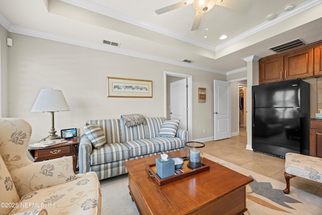 2144 S Sorrento Hills Rd, Saint Augustine, FL 32092 - living area with a raised ceiling, a ceiling fan, ornamental molding, and light tile patterned floors