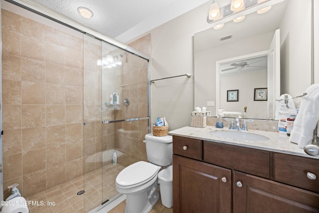2144 S Sorrento Hills Rd, Saint Augustine, FL 32092 - full bathroom featuring vanity, a shower stall, a ceiling fan, and a textured ceiling