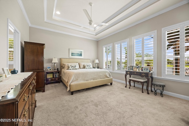 2144 S Sorrento Hills Rd, Saint Augustine, FL 32092 - bedroom with multiple windows, ornamental molding, a tray ceiling, and light carpet