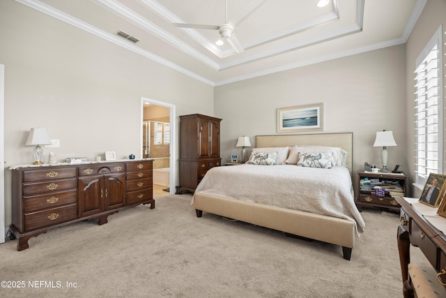 2144 S Sorrento Hills Rd, Saint Augustine, FL 32092 - bedroom featuring light carpet, ornamental molding, a tray ceiling, ceiling fan, and ensuite bath