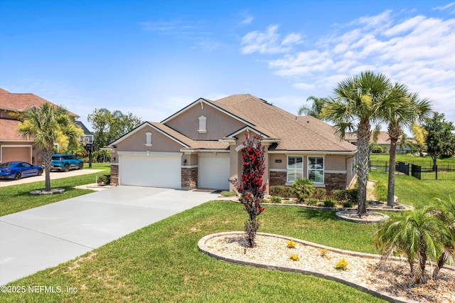 2144 S Sorrento Hills Rd, Saint Augustine, FL 32092 - view of front of home featuring stone siding, stucco siding, driveway, and an attached garage