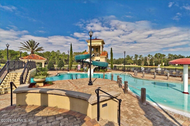 2148 S Sorrento Hills Rd, Saint Augustine, FL 32092 - community pool with a water slide and a patio