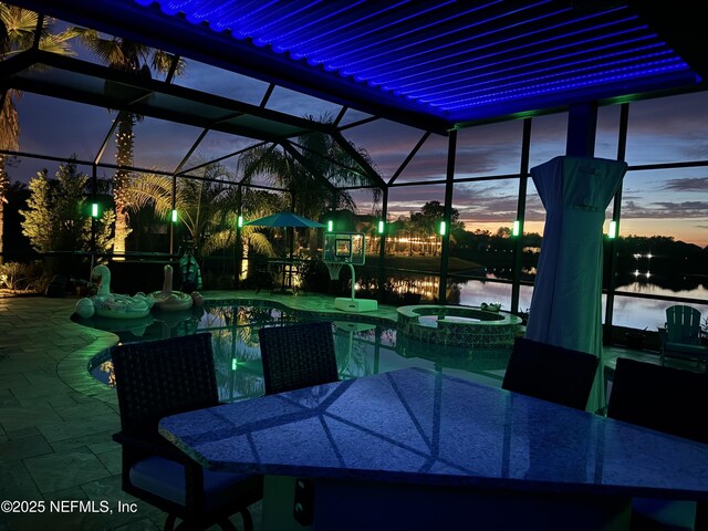 2148 S Sorrento Hills Rd, Saint Augustine, FL 32092 - view of patio / terrace with outdoor dining space, a lanai, and a pool with connected hot tub