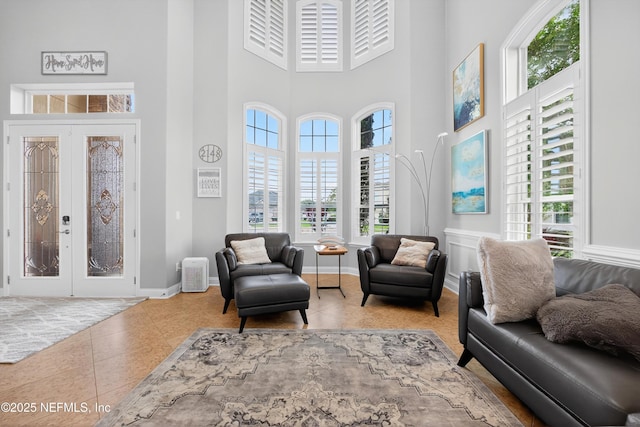 2148 S Sorrento Hills Rd, Saint Augustine, FL 32092 - tiled living room with plenty of natural light, a high ceiling, and french doors