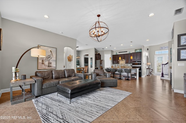 2148 S Sorrento Hills Rd, Saint Augustine, FL 32092 - living area with a chandelier, arched walkways, and recessed lighting