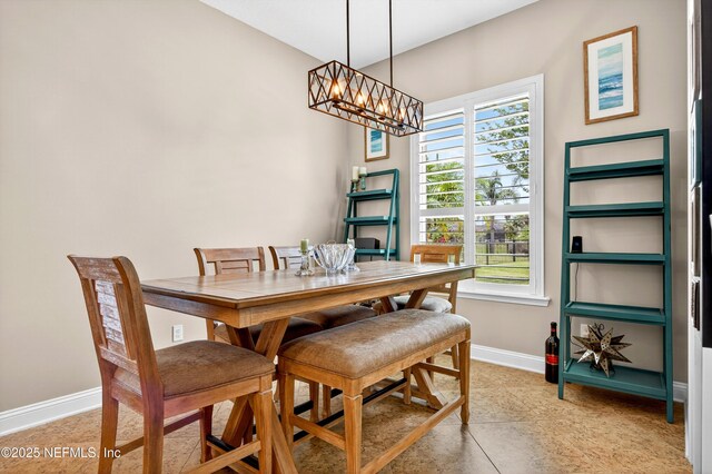2148 S Sorrento Hills Rd, Saint Augustine, FL 32092 - dining room featuring baseboards and a chandelier