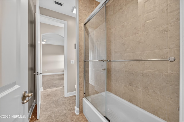 2148 S Sorrento Hills Rd, Saint Augustine, FL 32092 - bathroom with combined bath / shower with glass door, tile patterned floors, and a ceiling fan
