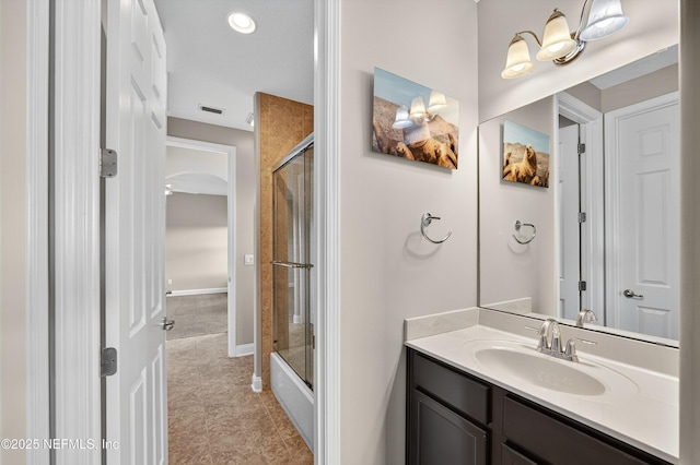 2148 S Sorrento Hills Rd, Saint Augustine, FL 32092 - full bathroom featuring vanity, tile patterned flooring, and bath / shower combo with glass door