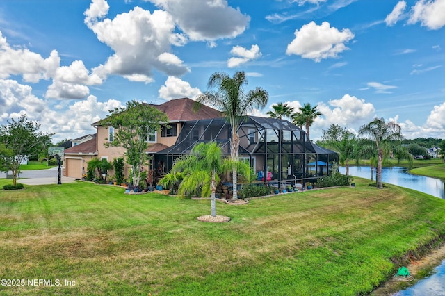 2148 S Sorrento Hills Rd, Saint Augustine, FL 32092 - exterior space featuring a water view, a lawn, a lanai, and an attached garage