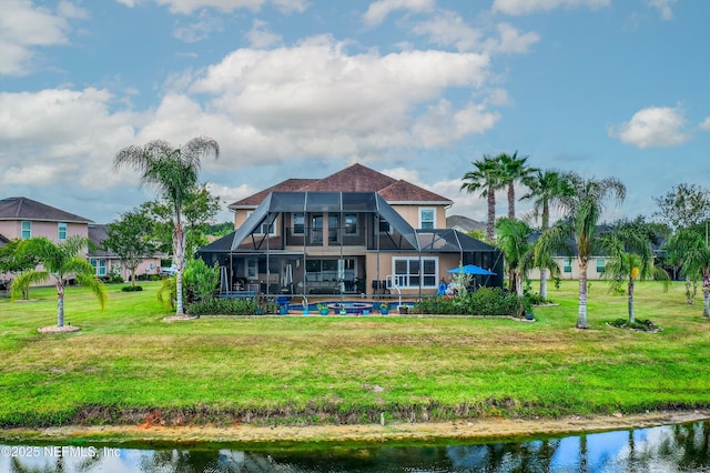 2148 S Sorrento Hills Rd, Saint Augustine, FL 32092 - rear view of house with a lanai, a pool, a yard, and a water view