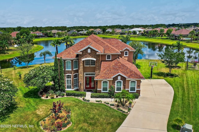 2148 S Sorrento Hills Rd, Saint Augustine, FL 32092 - view of front of home with stone siding, a water view, and a front lawn